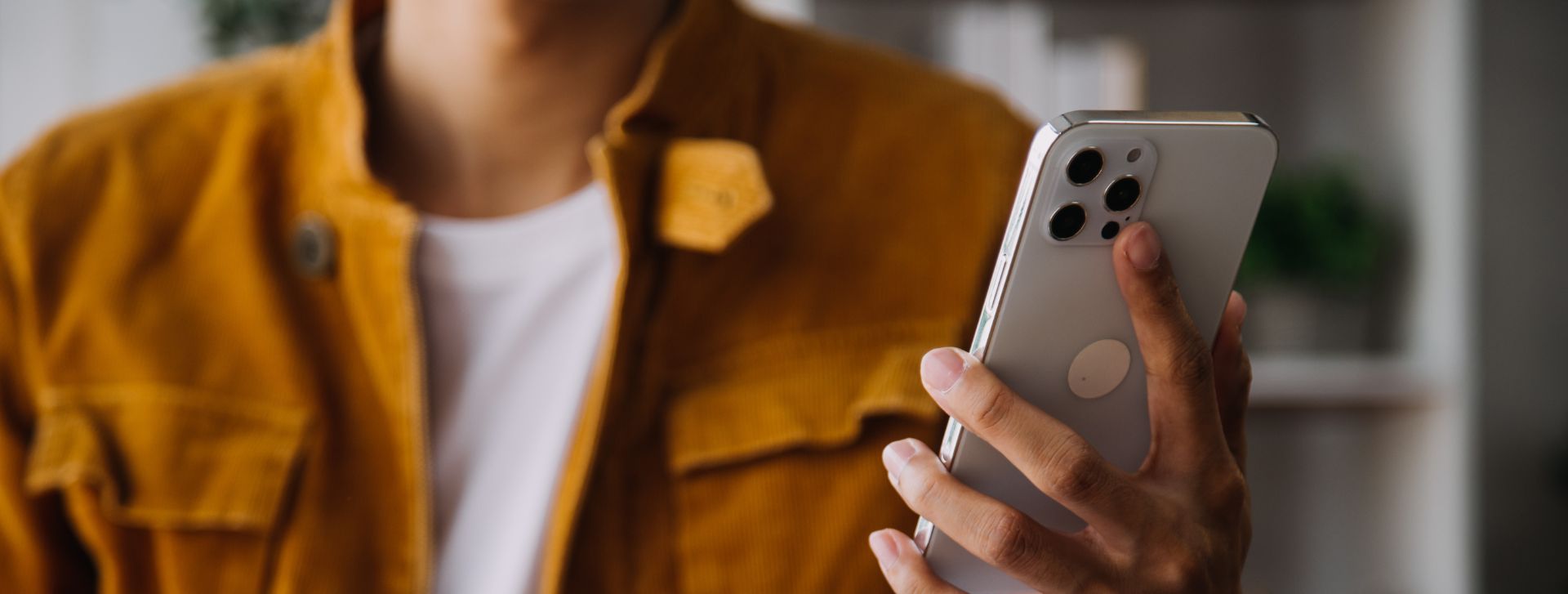 a man holding a phone in anevem agency
